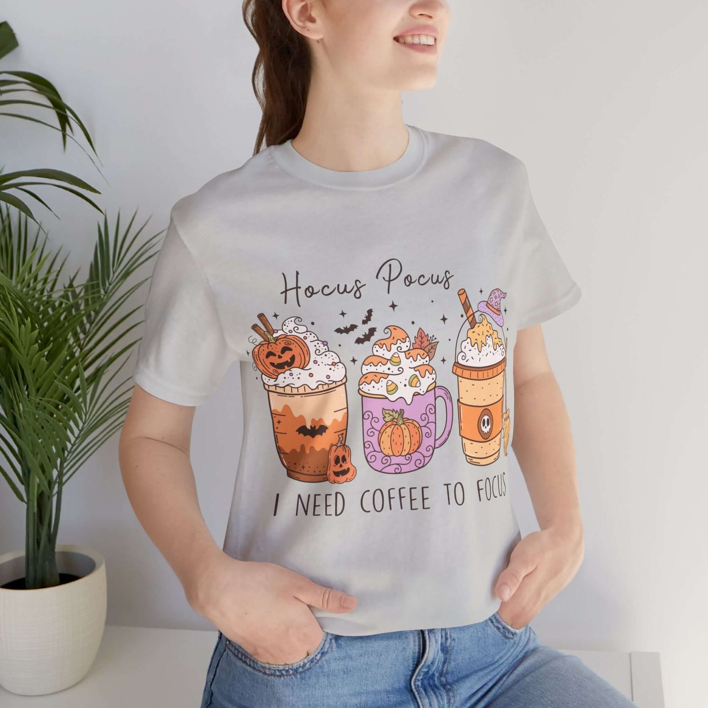 Halloween Coffee Lover's T-shirt, Hocus Pocus I Need Coffee to Focus, Women's Spooky Shirt for Brew-Witching Mornings and Halloween Parties.