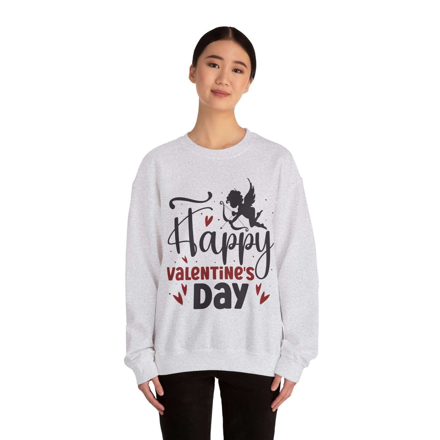 Woman wearing Valentine's Day sweatshirt with 'Happy Valentine's Day' text and cupid graphic, perfect for festive celebrations.