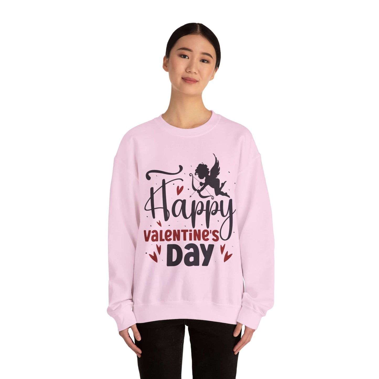 Person wearing a pink Valentine's Day sweatshirt with 'Happy Valentine's Day' text and cupid graphic, perfect for romantic celebrations.