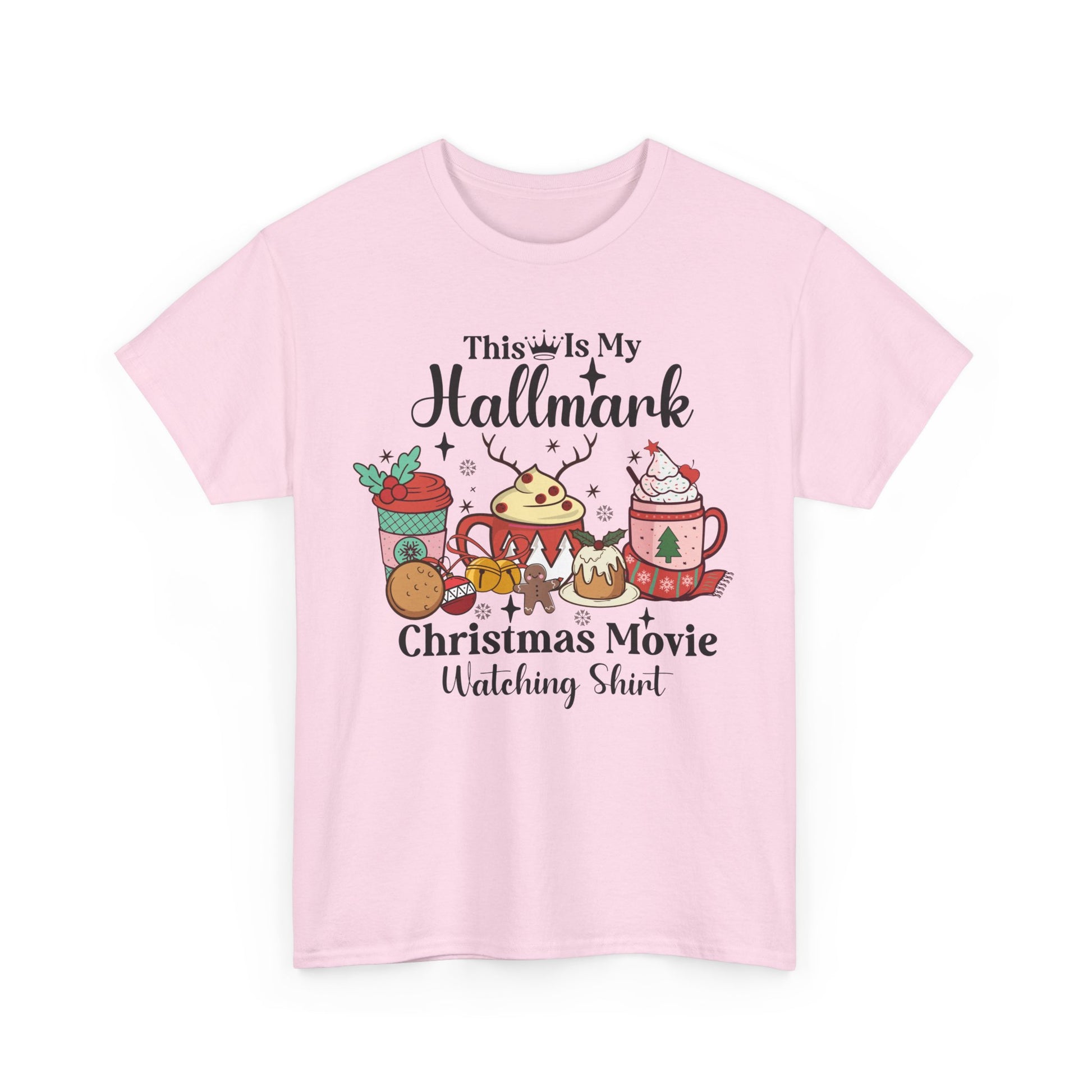 Pink T-shirt with "This Is My Hallmark Christmas Movie Watching Shirt" graphic featuring festive mugs and treats.