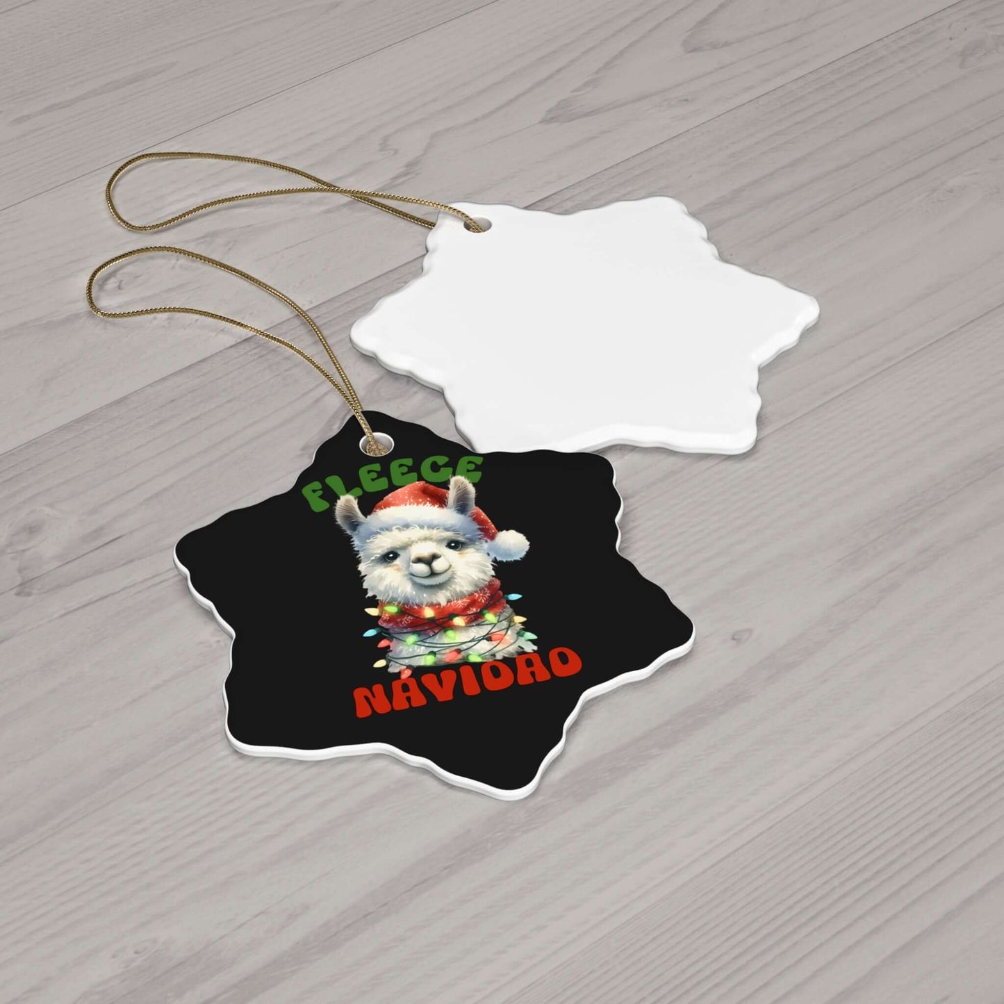 Colorful festive ceramic ornament with "Fleece Navidad" and a playful llama design, perfect for holiday decor.