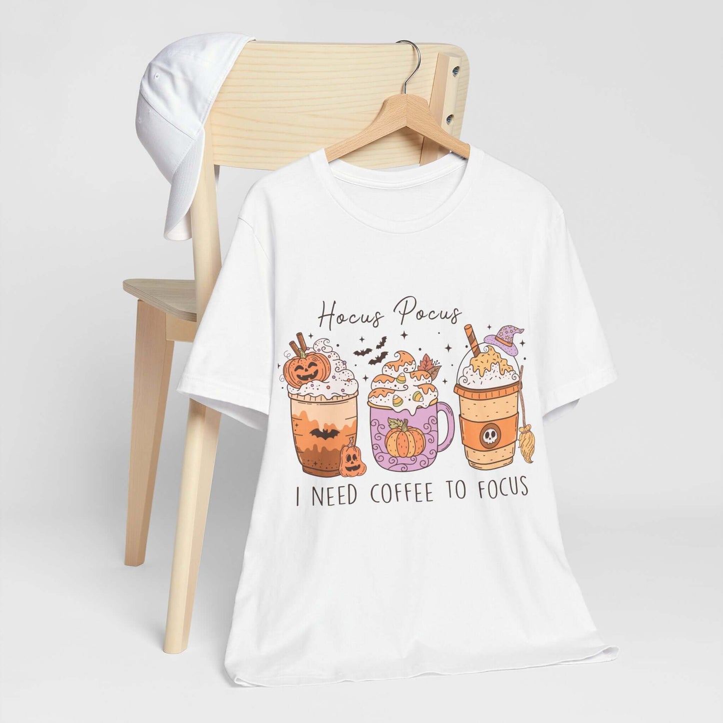 Halloween Coffee Lover's T-shirt, Hocus Pocus I Need Coffee to Focus, Women's Spooky Shirt for Brew-Witching Mornings and Halloween Parties.