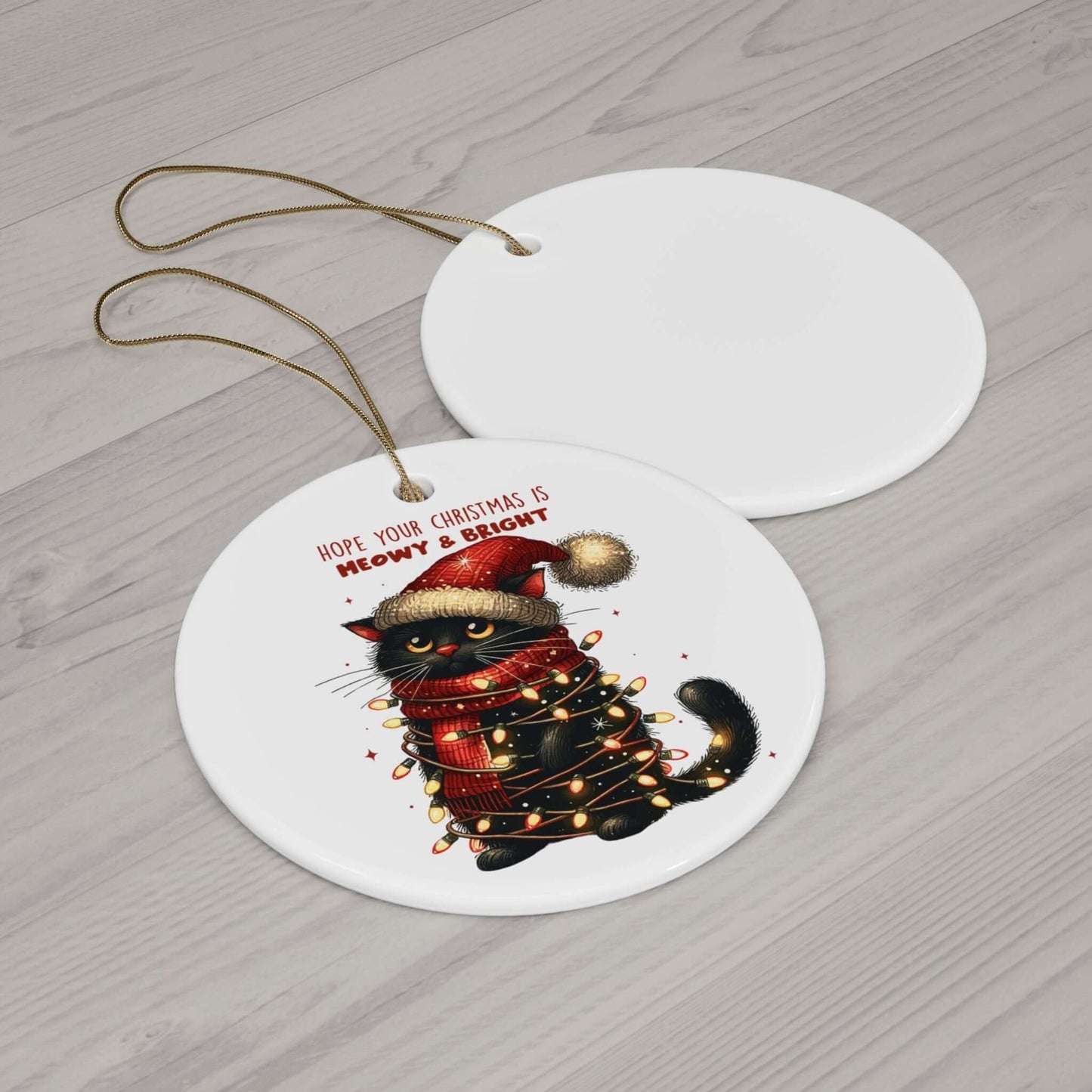 Meowy Xmas ceramic ornament featuring a playful cat wrapped in Christmas lights, perfect for cat lovers and festive decor.