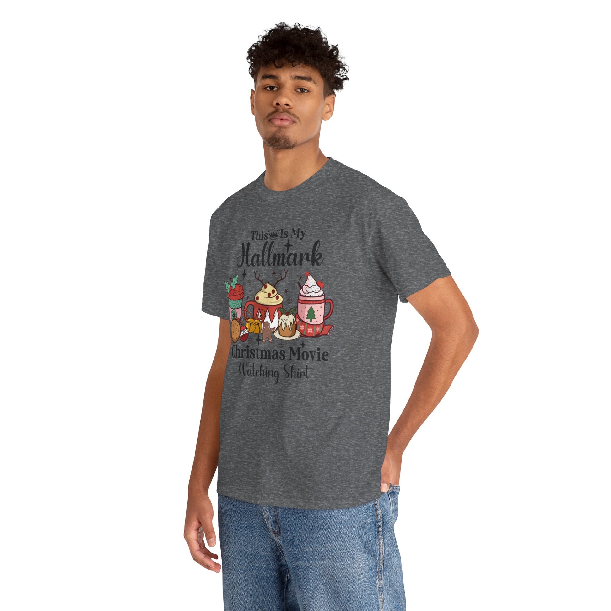 Young man wearing a cozy holiday T-shirt featuring festive designs and the phrase "This is My Hallmark Christmas Movie Watching Shirt."