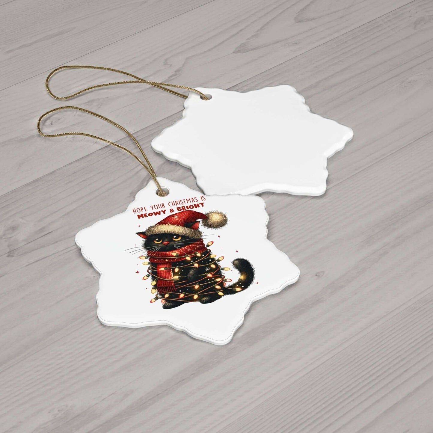 Ceramic star ornament featuring a festive cat wrapped in Christmas lights, perfect for cat lovers during the holidays.