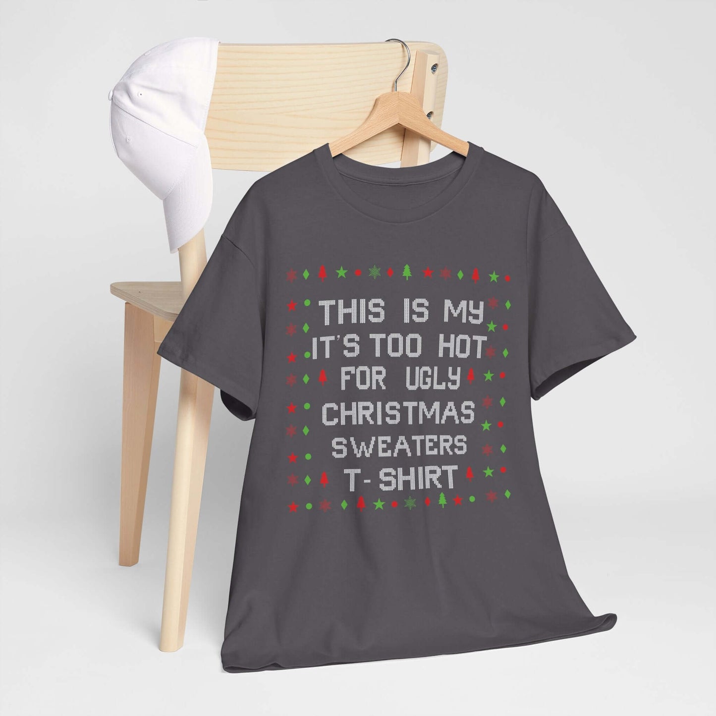 Casual Christmas T-Shirt saying "Too Hot for Ugly Sweaters" on a chair, perfect for festive gatherings and comfortable holiday wear.