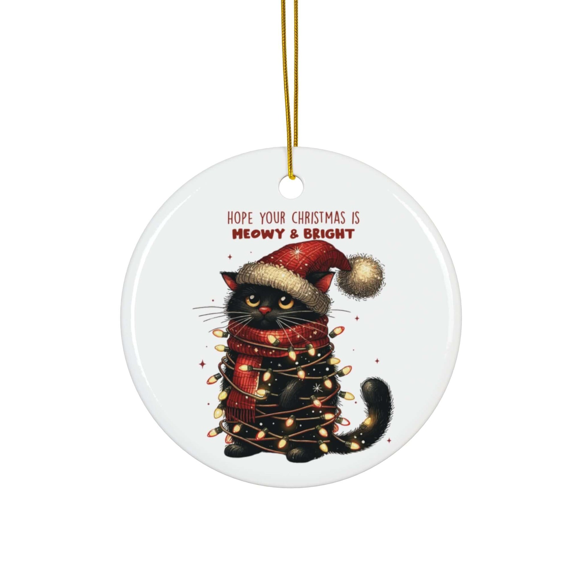 Ceramic ornament featuring a black cat in a Santa hat with Christmas lights, captioned "Hope Your Christmas is Meowy & Bright."