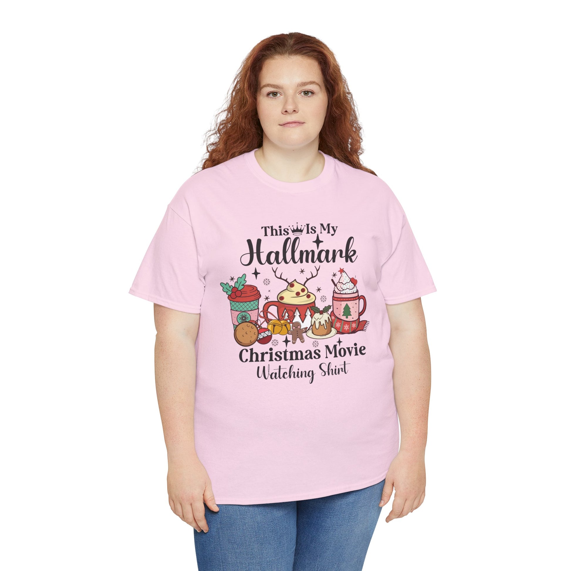 Cozy pink Christmas T-shirt with "This is My Hallmark Christmas Movie Watching Shirt" design for holiday festivities.