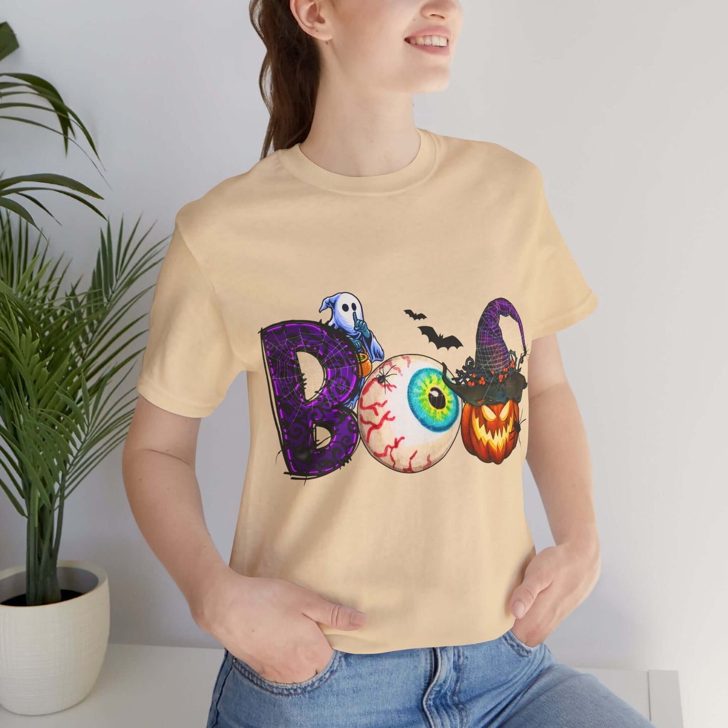 Halloween 'Boo' Women's T-shirt, Spooky Eyeball and Pumpkin Design, Cartoon Scary Tee for Unique Halloween Outfits and Fun Trick-or-Treating