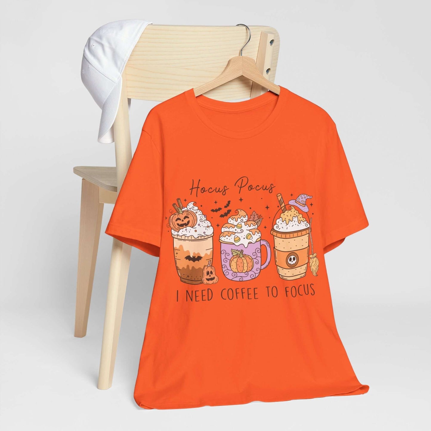 Halloween Coffee Lover's T-shirt, Hocus Pocus I Need Coffee to Focus, Women's Spooky Shirt for Brew-Witching Mornings and Halloween Parties.