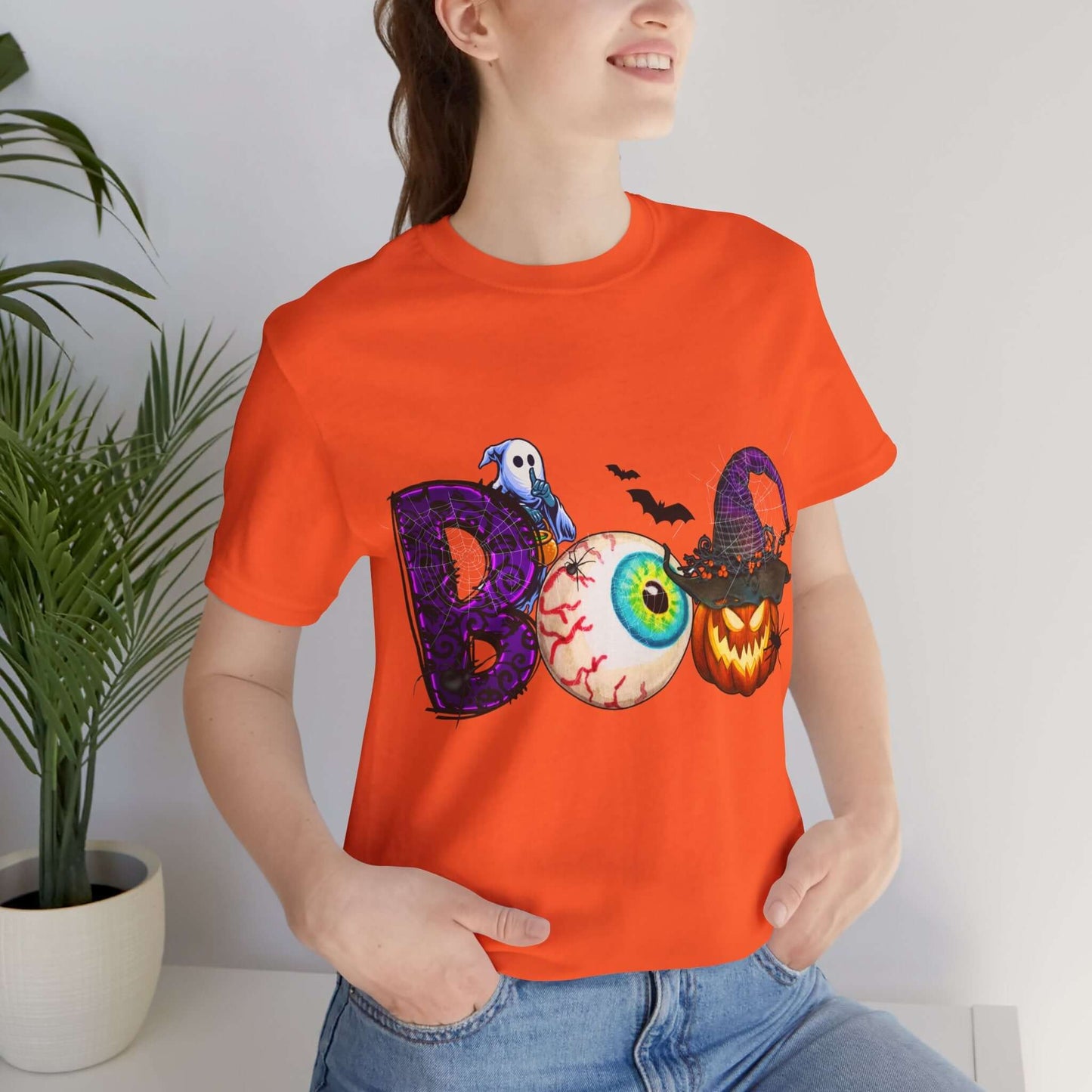 Halloween 'Boo' Women's T-shirt, Spooky Eyeball and Pumpkin Design, Cartoon Scary Tee for Unique Halloween Outfits and Fun Trick-or-Treating