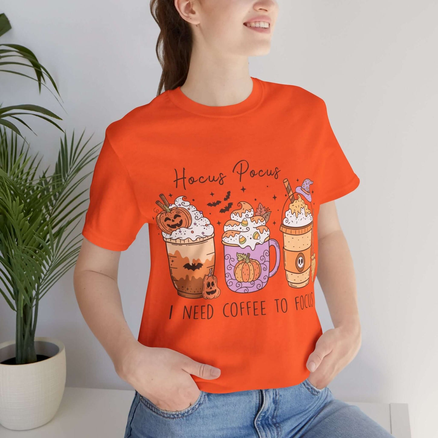 Halloween Coffee Lover's T-shirt, Hocus Pocus I Need Coffee to Focus, Women's Spooky Shirt for Brew-Witching Mornings and Halloween Parties.