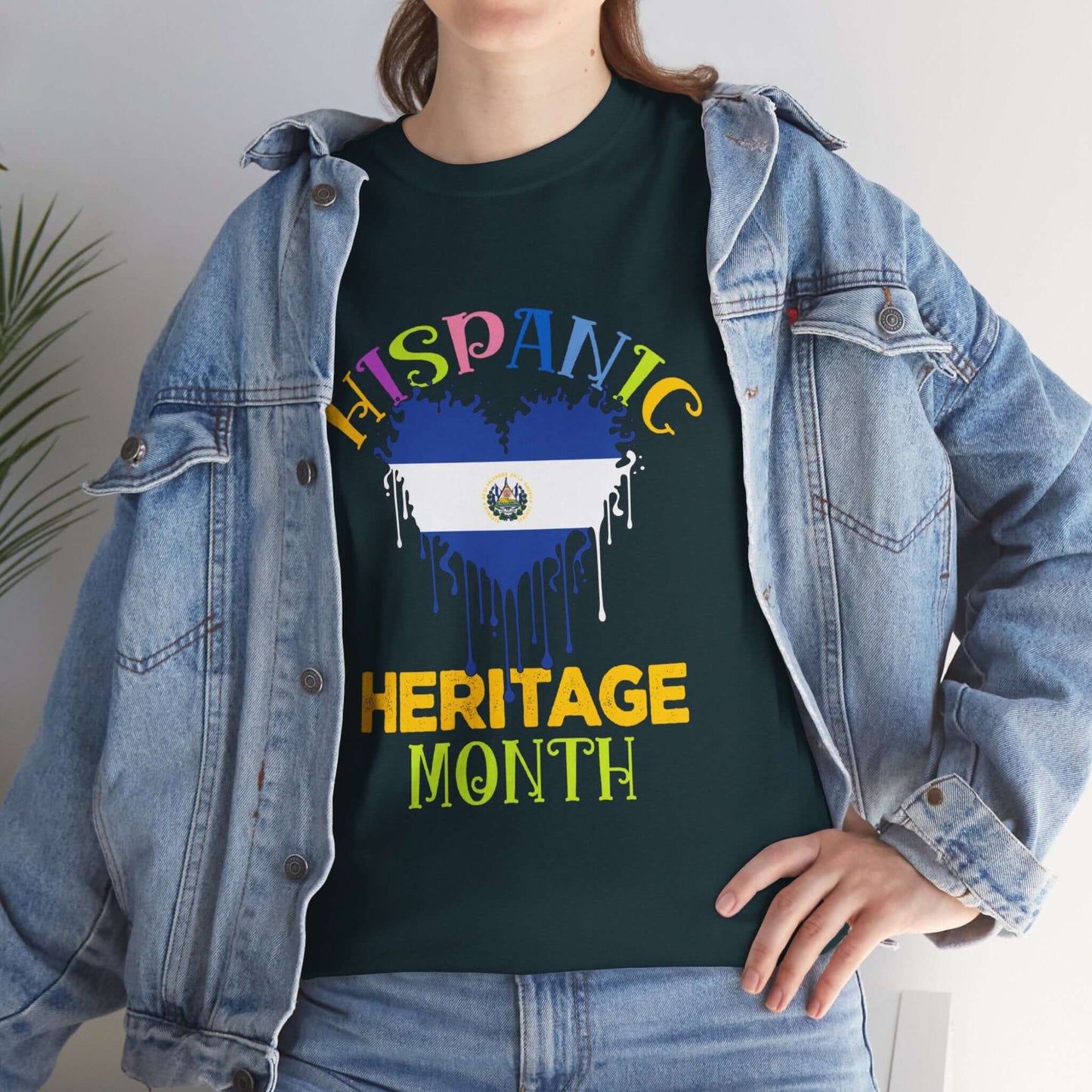 Celebrating Hispanic Heritage Month with Salvadorian heart flag graphic tee worn by person in denim jacket