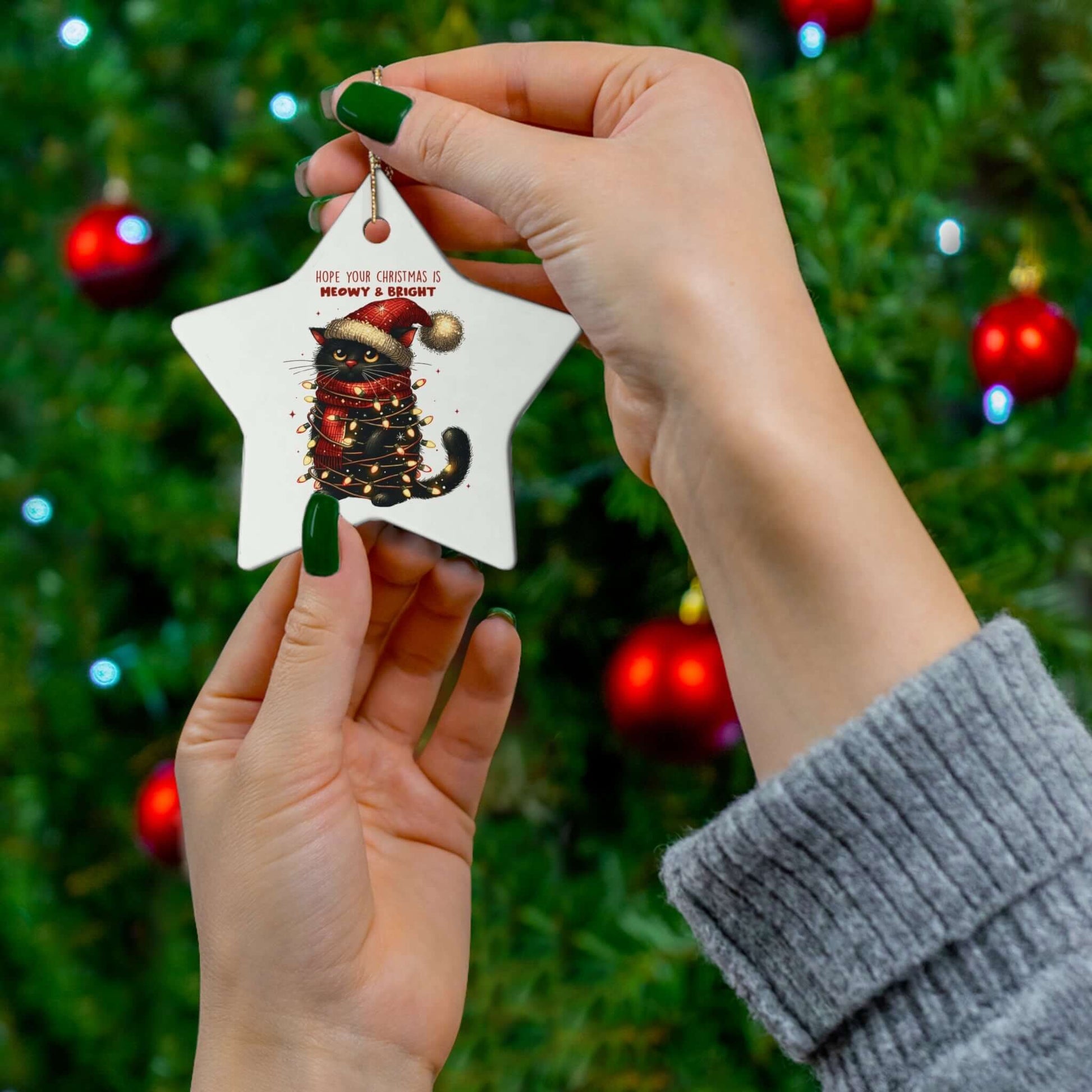 Adorable star-shaped ceramic ornament featuring a cat, perfect for cat lovers and holiday decor.