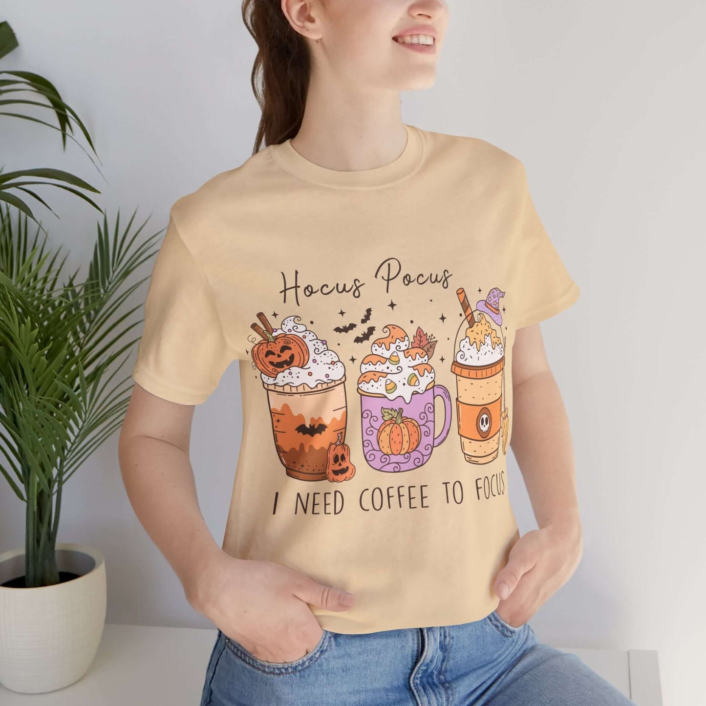 Halloween Coffee Lover's T-shirt, Hocus Pocus I Need Coffee to Focus, Women's Spooky Shirt for Brew-Witching Mornings and Halloween Parties.