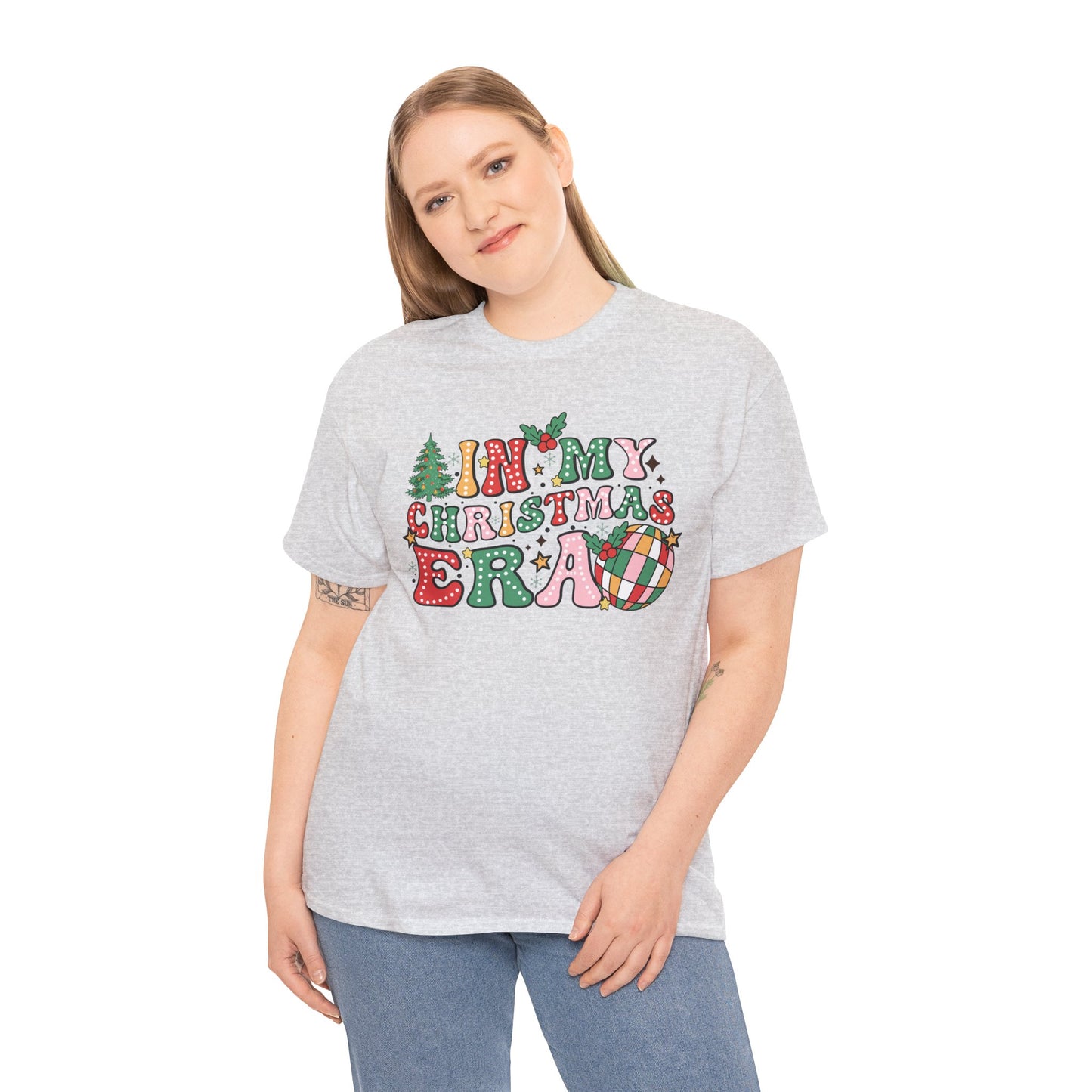 Woman wearing 'In My Christmas Era' festive t-shirt with colorful holiday design and Christmas elements.